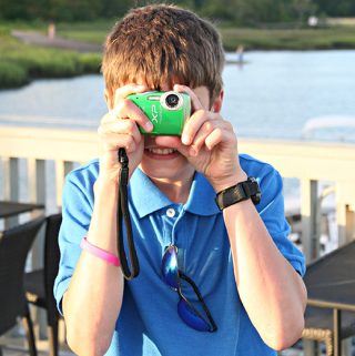 Tweens love to take photos, and are at a great age to have their own cameras. Great tween travel tips at Meander & Coast